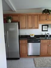 Remodeled Kitchen with new cabinets, appliances and tile floors by Compton Contracting